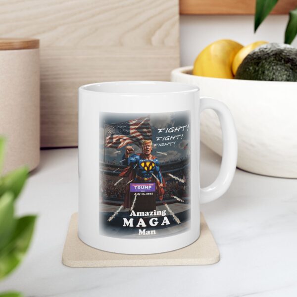 Amazing MAGA Man white ceramic mug on a wooden coaster