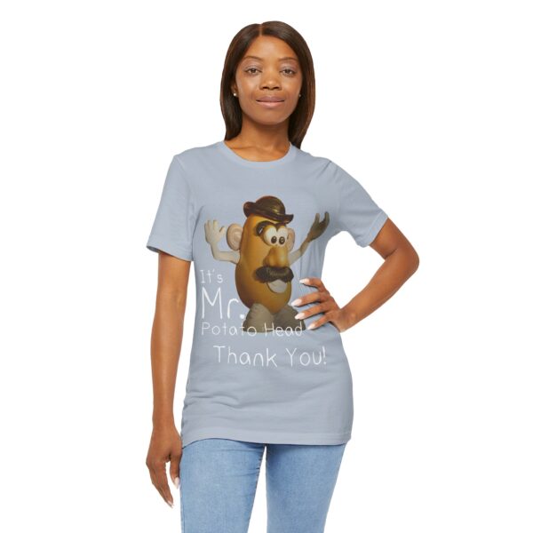 black girl wearing light blue It's Mr. Potato Head t-shirt white text