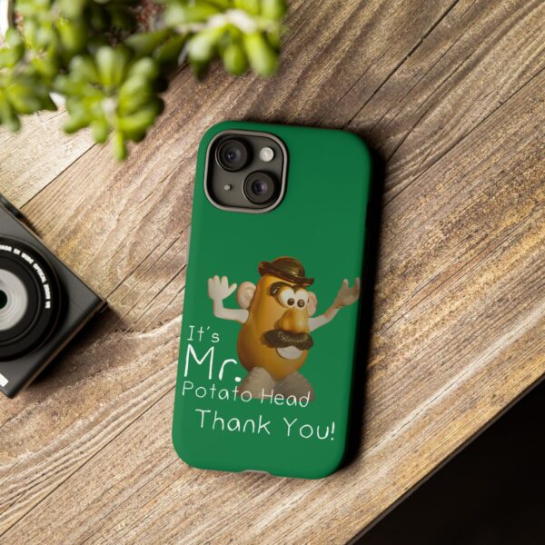 Green Custom It's Mr. Potato Head Thank YouTough Phone Cases for iPhone 15 on a table