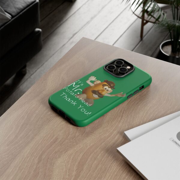 Green Custom It's Mr. Potato Head Thank YouTough Phone Cases for iPhone 14 Pro Max on a table