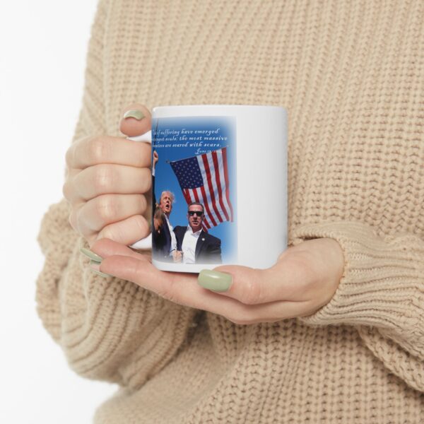 Woman in beige sweater holding Trump Seared With Scars white ceramic mug