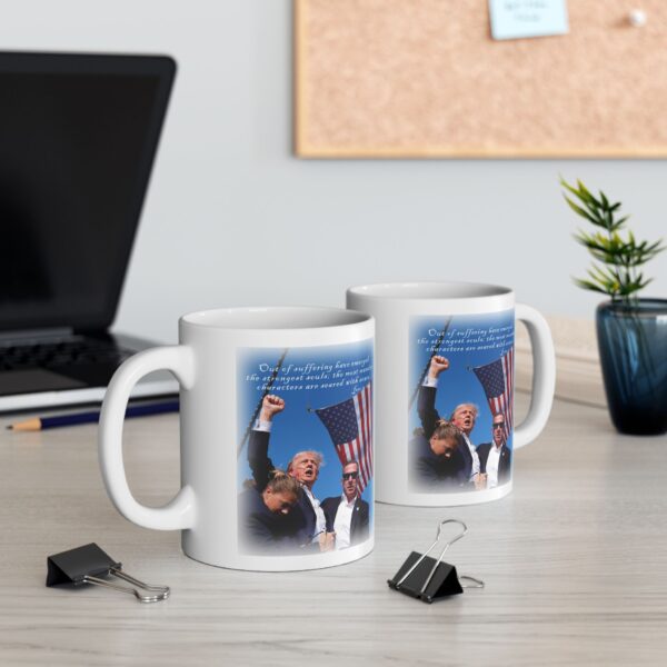 Two Mug Trump Seared With Scars white ceramic mugs next to a laptop