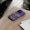 Purple Custom Trumped Again Tough Phone Cases for iPhone 14 Pro Max on a table